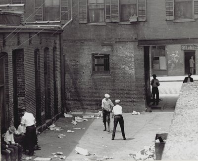 Group of Men and Boys in an Unidentified Courtyard-Alley by Unknown